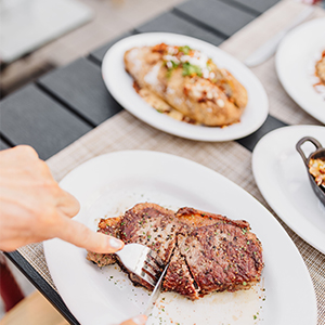 Cutting a steak at Nick's Steakhouse